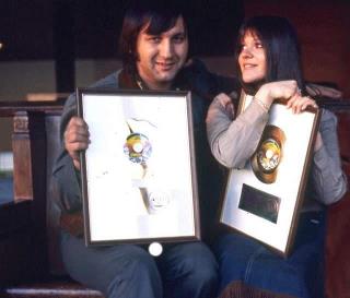 Melanie and Peter shwoing the golden record of Brand New Key